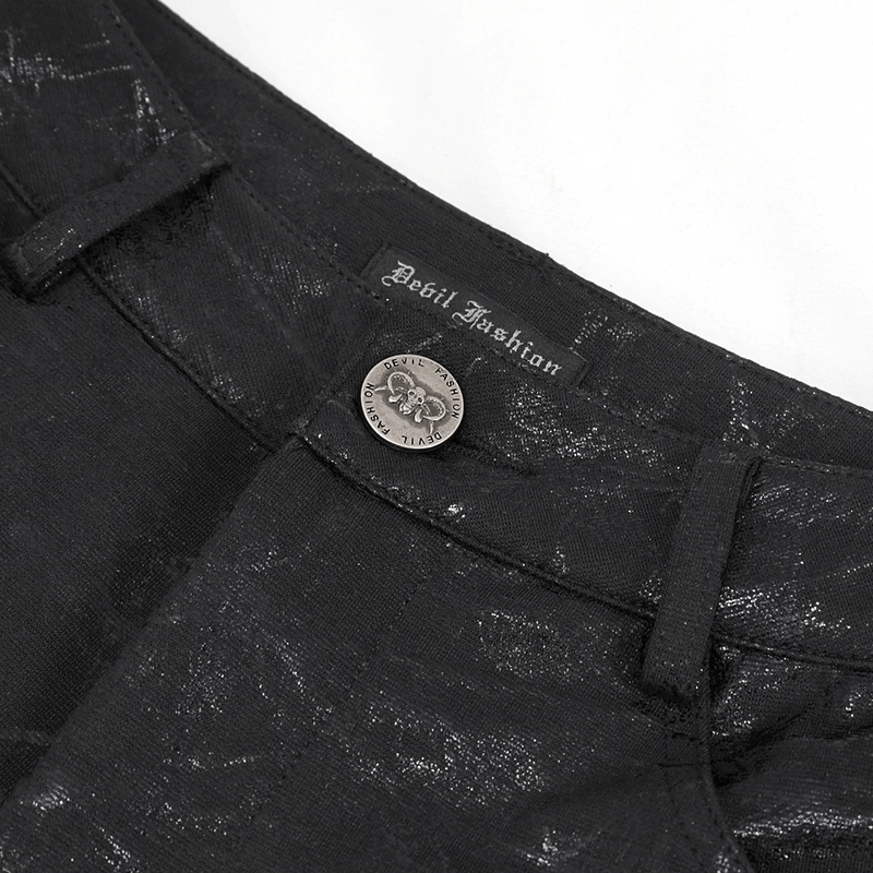 Close-up of buckle accent on Gothic women's black slim-fitted pants by Devil Fashion, showcasing stylish design.