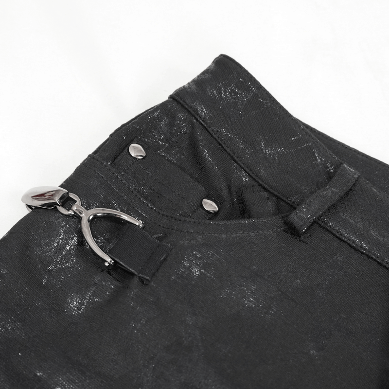 Close-up of gothic women's slim fitted black pants, highlighting buckle accents and stylish details.