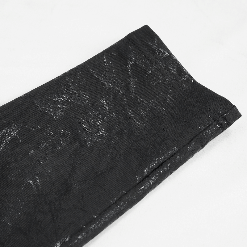 Gothic women's slim-fitted black pants showcasing stylish buckle accents and unique texture.