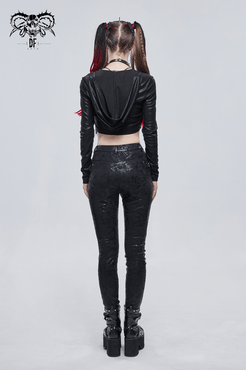 Model wearing gothic black slim-fitted pants with buckle accents, showcasing a stylish back view.