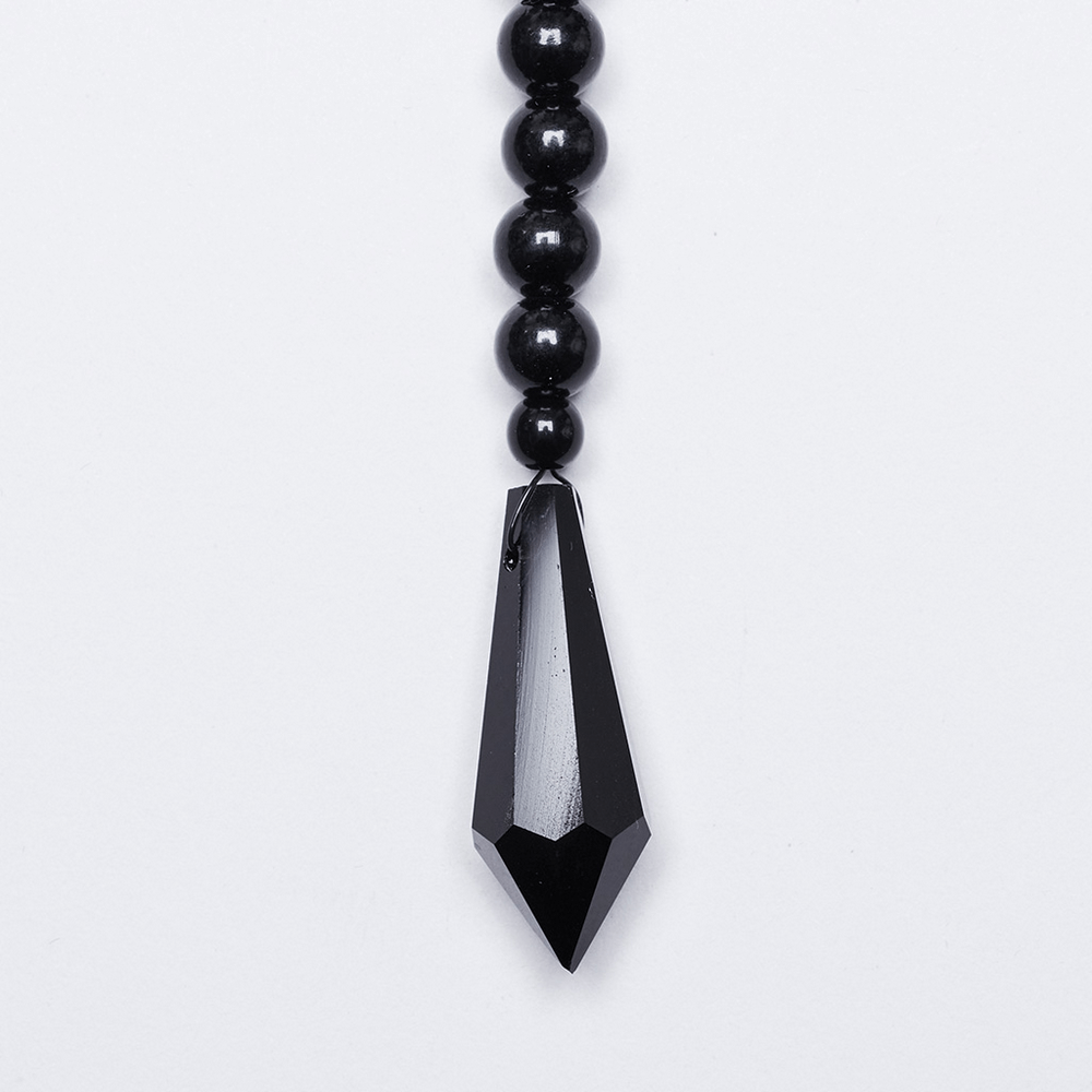 black beaded necklace with sleek pendent on white background