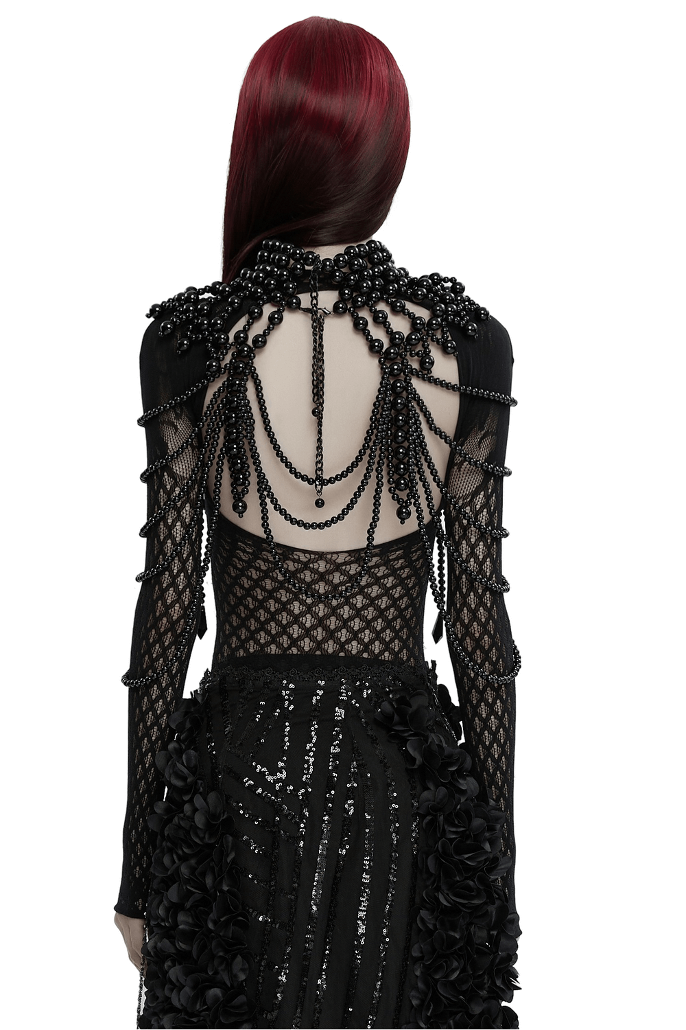 Gothic women's pearl body accessory with skull accent and black beaded strands on mesh dress, showcasing dark elegance and sophistication.