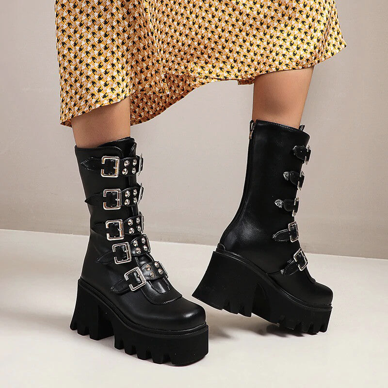 Gothic womens platform boots featuring buckle straps and a high sole, perfect for edgy rock outfits.