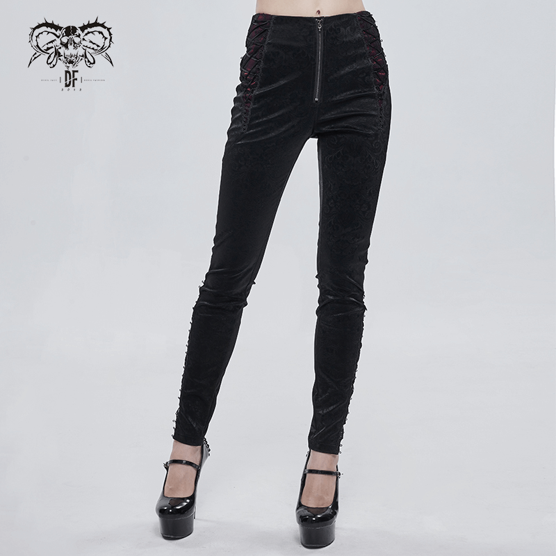 Gothic women's black PU leather high-waisted pants with red lace detail and zipper, flattering form-fitting design