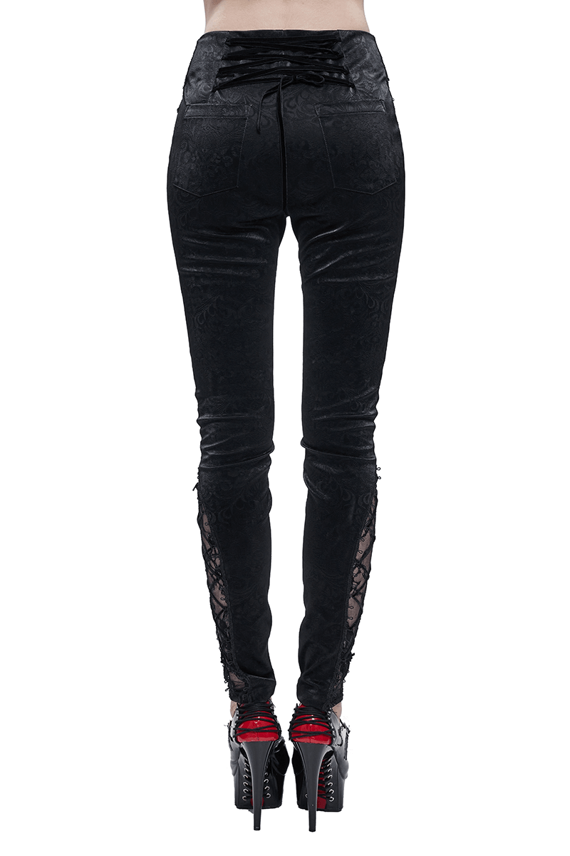 High-waisted black PU leather pants with red lace details and string, perfect for a gothic fashion statement.