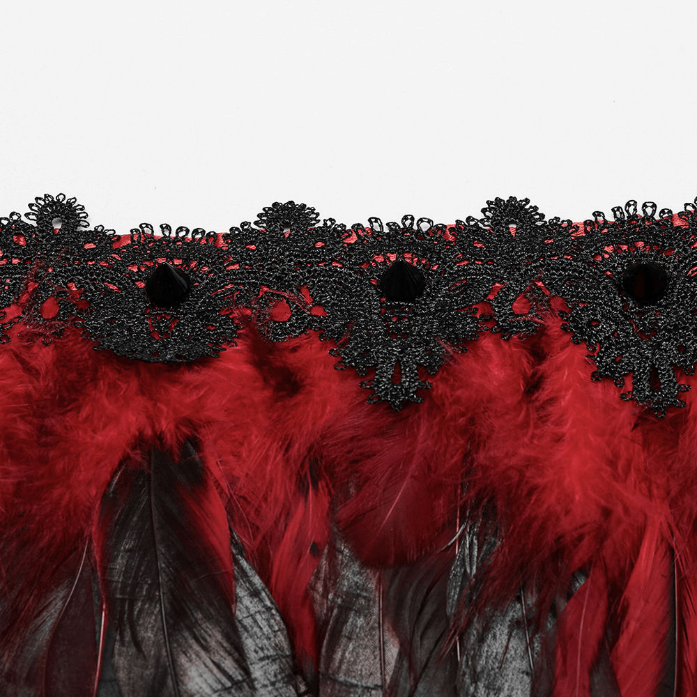 Dramatic black and red feather shoulder accessory with intricate lace detailing for gothic fashion.