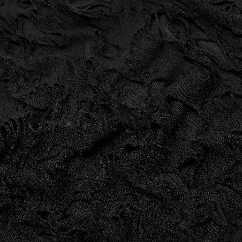 Close-up of black elastic knit fabric with ragged texture for gothic-style fashion items.