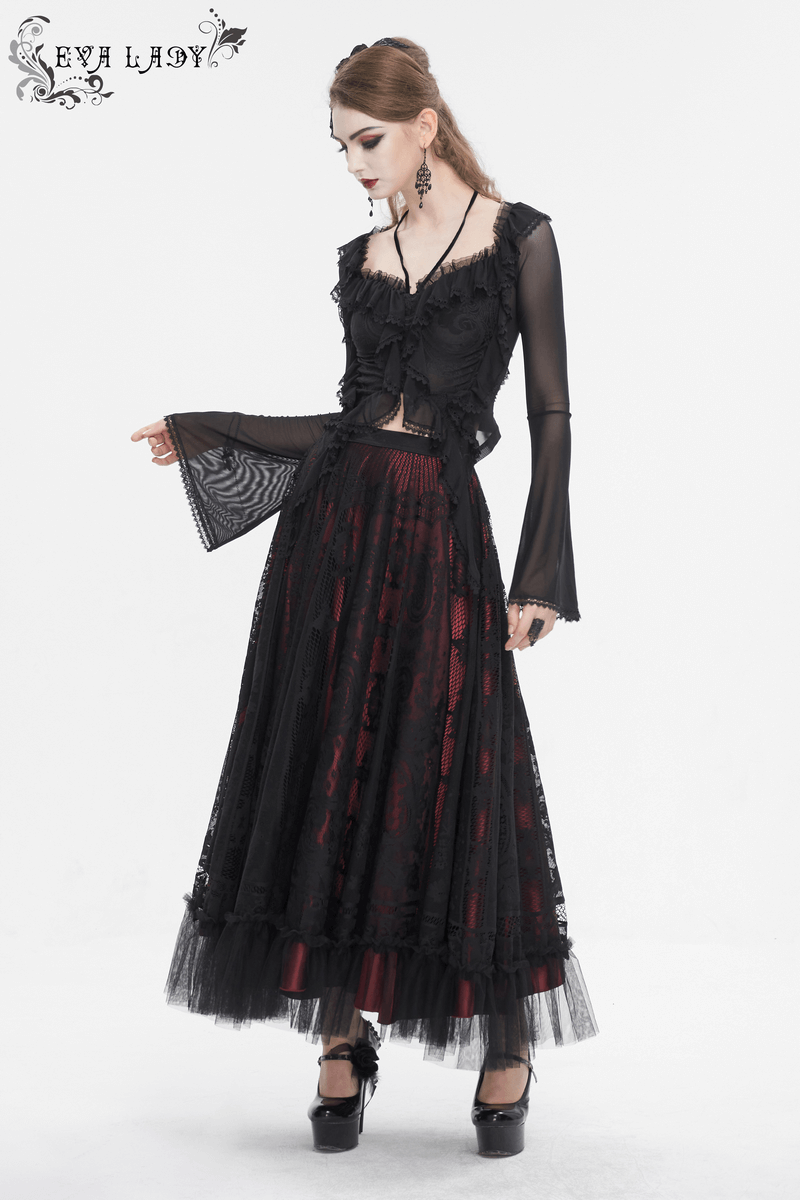 Gothic women's ruffled top with transparent sleeves and lace-up back, styled with a flowing black skirt.