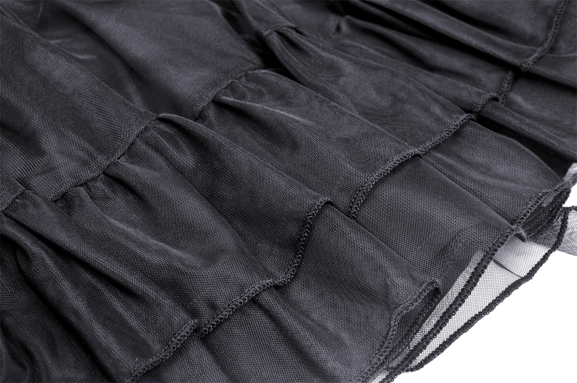 Close-up of black gothic short pleated skirt showing textured layers and soft mesh material, perfect for a punk rock style.