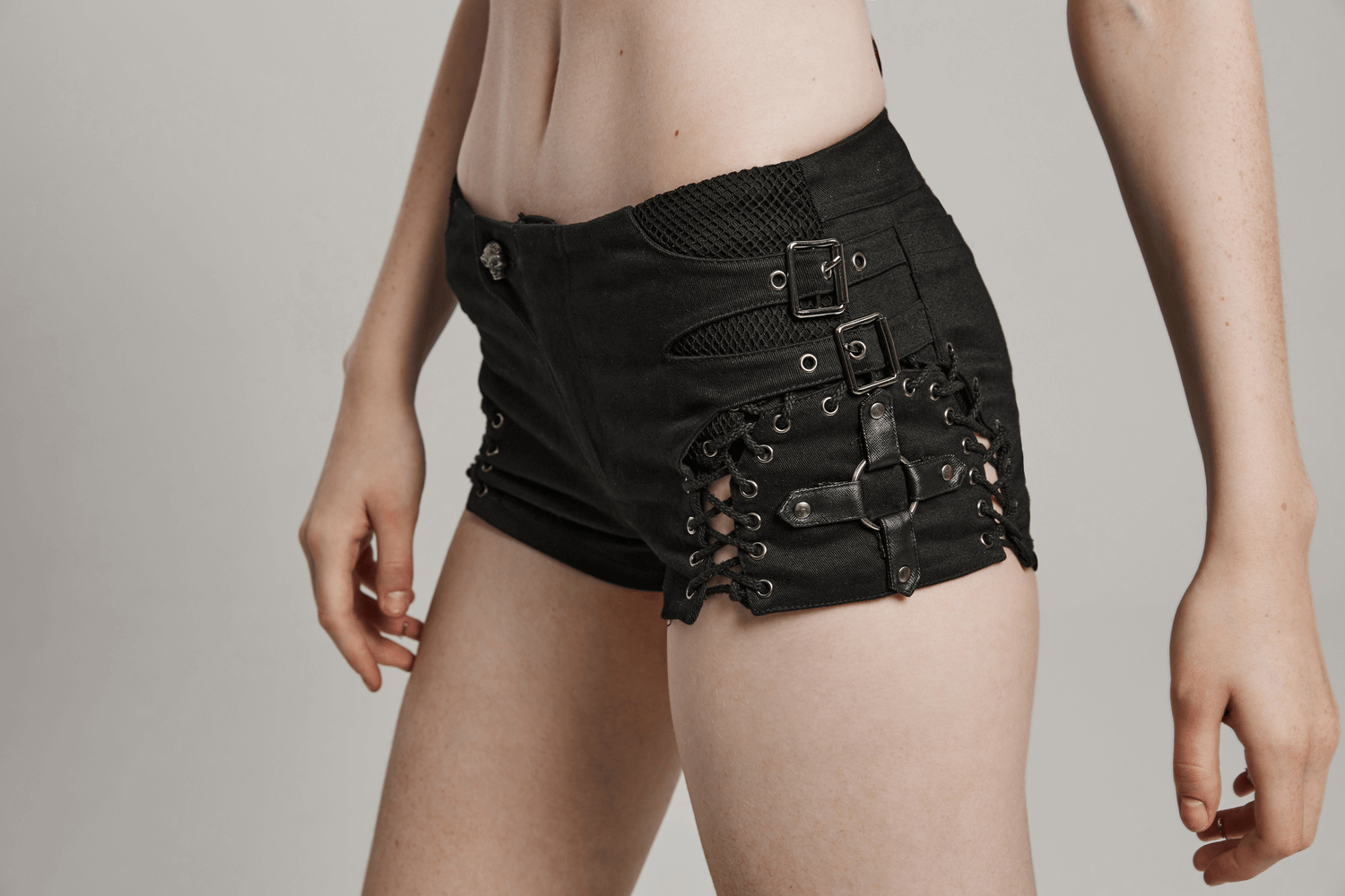 Gothic women's black lace-up shorts with side laces and edgy buckle detail for a punk-inspired look.