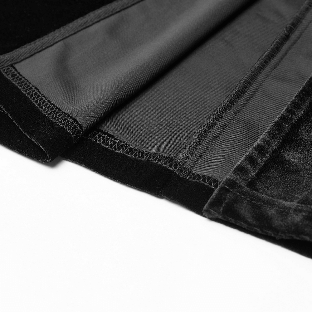 Close-up of the luxurious velvet fabric and detailed stitching of a Gothic women's suspender dress.