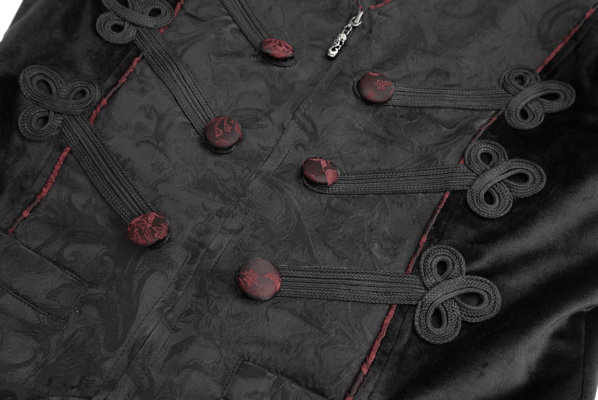 Close-up of gothic style black vest, featuring red buttons and intricate lacing details, perfect for an alternative fashion look.