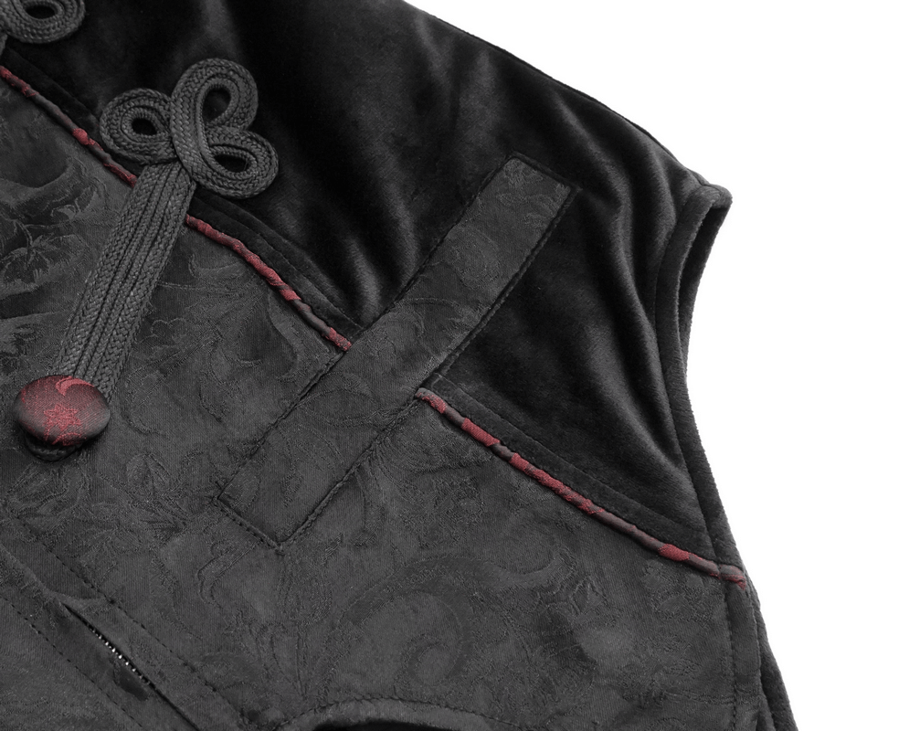 Close-up of gothic black vest with vintage print and red buttons, featuring intricate lacing details.