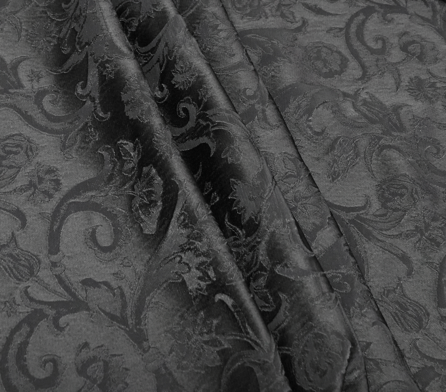 Elegant black jacquard fabric with floral patterns, ideal for gothic-style vests and alternative fashion.