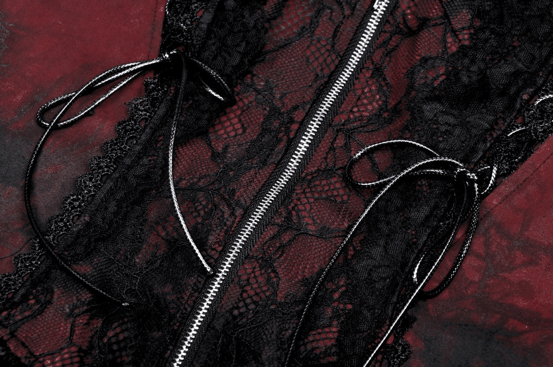 Close-up of vintage-inspired Gothic dress with black lace overlay and red fabric, showcasing intricate lace and corset details.