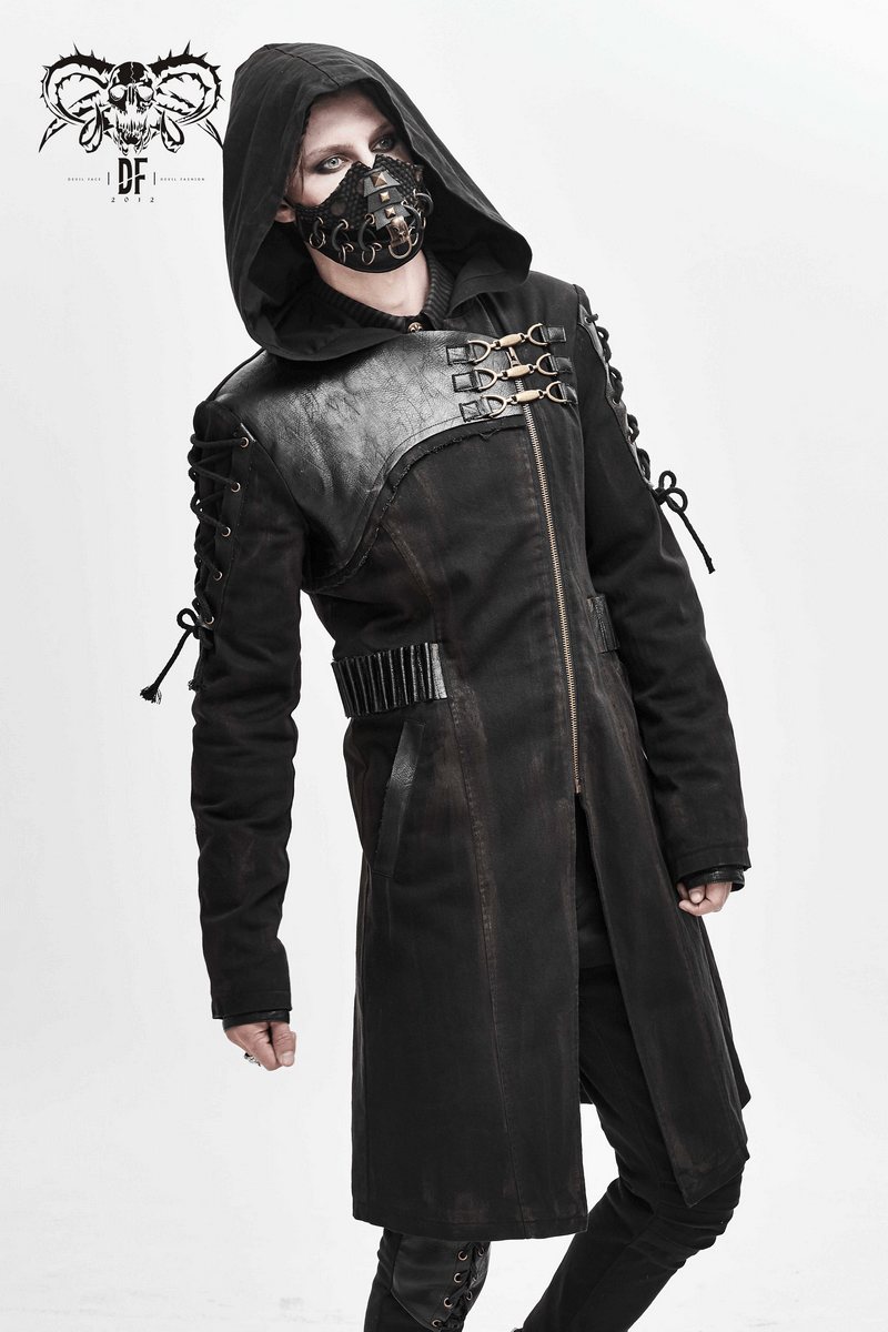 Man in a gothic zipper hooded trench coat with buckles and lace-up sleeves, styled with a black mask.