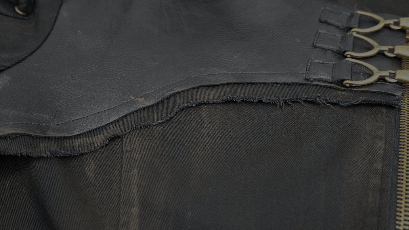 Close-up of the Gothic zipper hooded trench coat showing buckles and distressed fabric details.