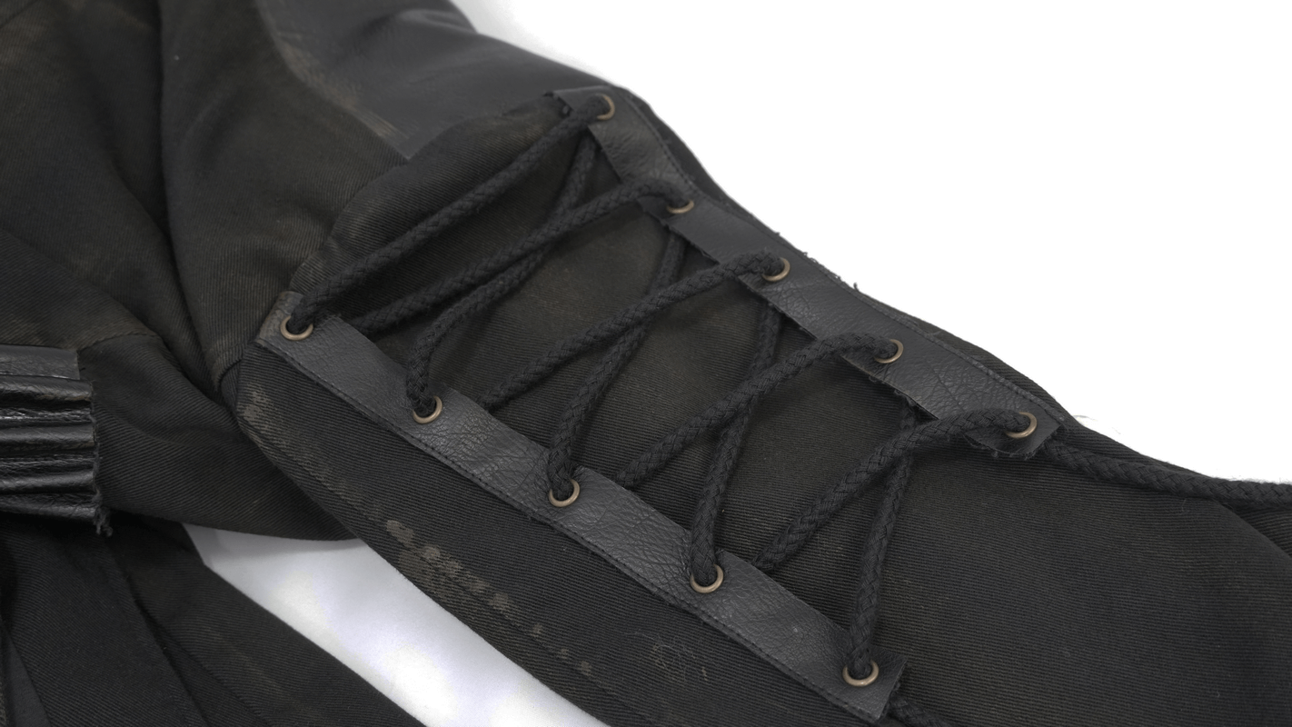 Close-up of lace-up detail on sleeve of black gothic trench coat for men.