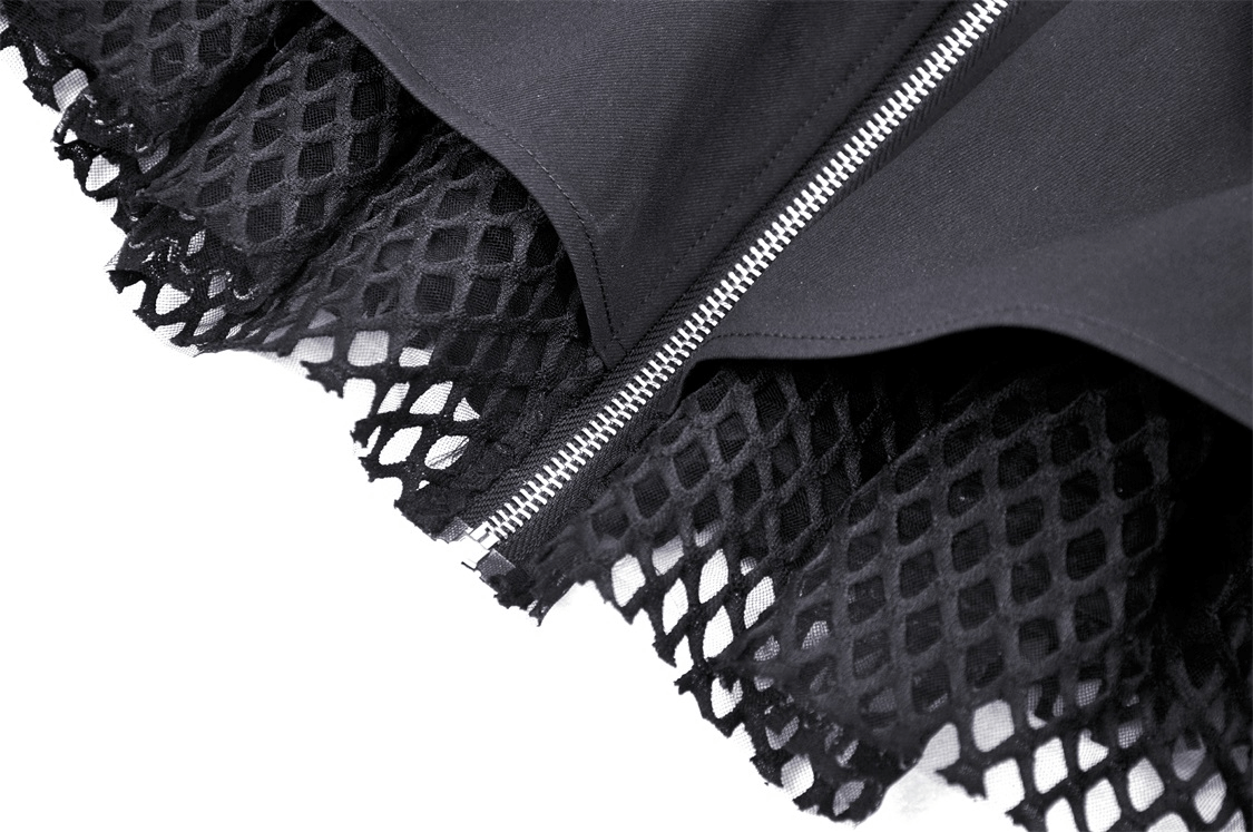 Close-up of a gothic mini skirt featuring a zipper and lace-up design with bold black mesh details.