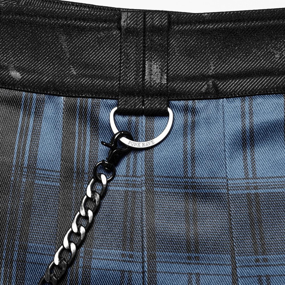 Close-up of gradient Scottish punk kilt with detachable chain and metal detail, showcasing bold plaid design.