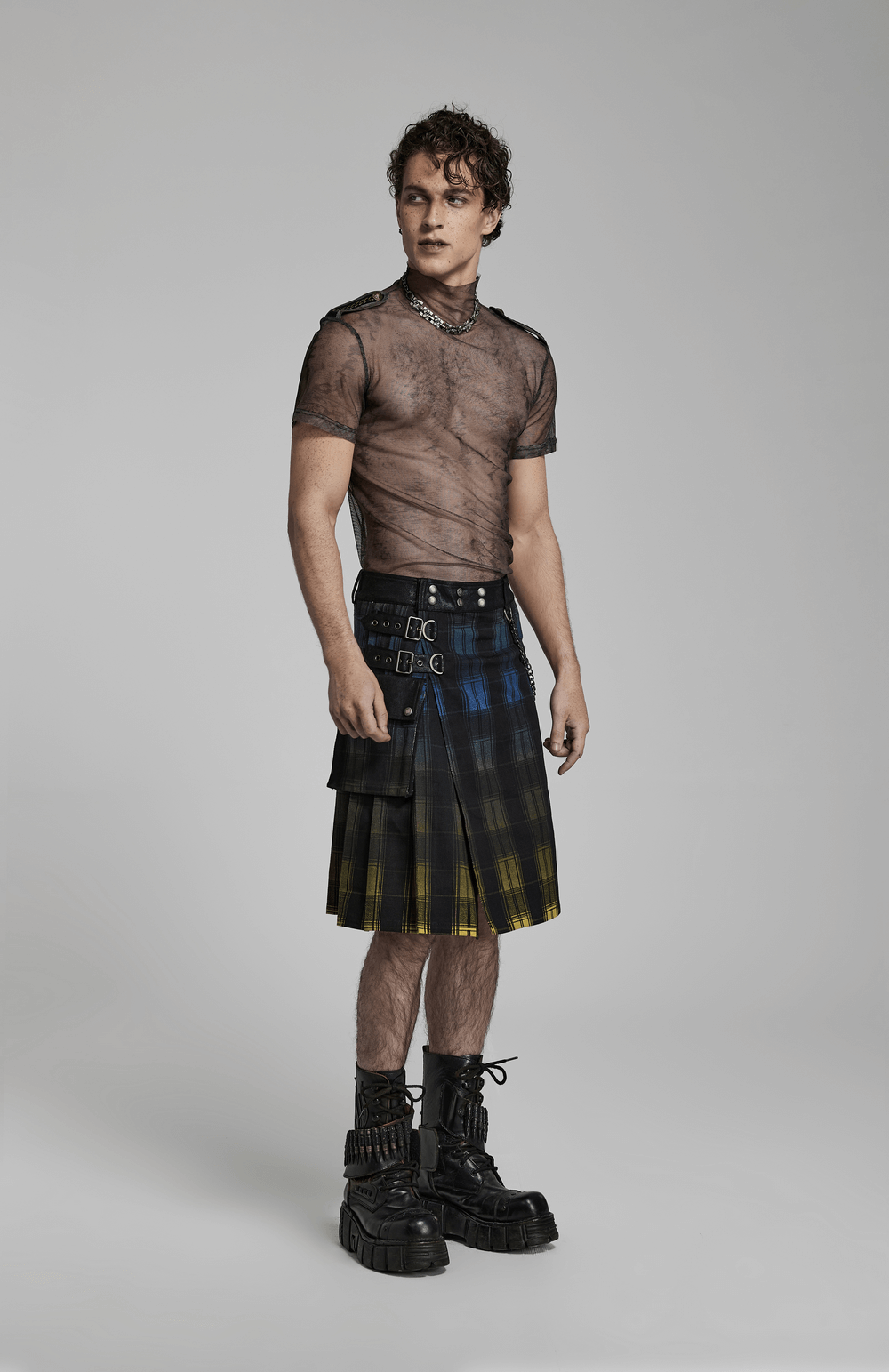 Model showcasing a Gradient Scottish Punk Kilt with detachable metal details and stylish black boots.