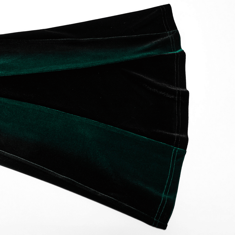 Gradient velvet flared pants showcasing rich black and green fabric with elegant pleats and a stylish hemline.