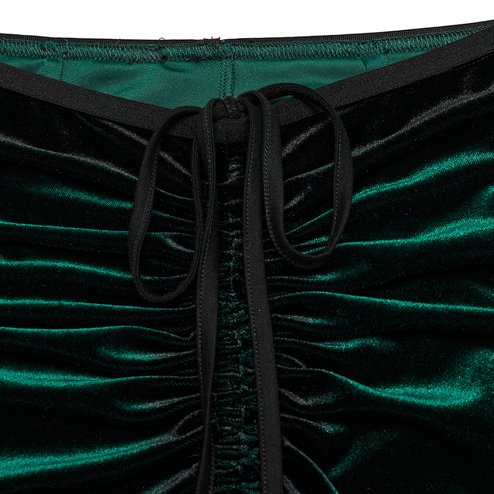 Close-up of gradient velvet pants' waist strap and pleats, showcasing luxurious texture and gothic-inspired design.