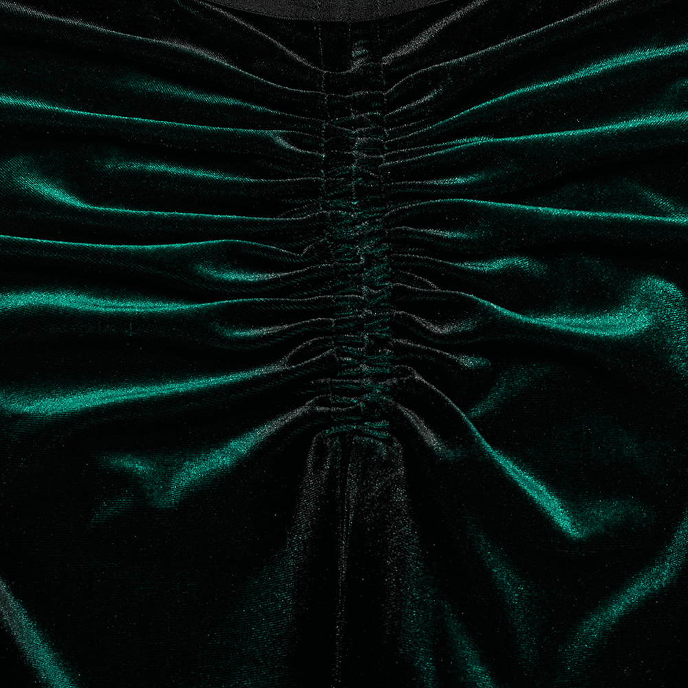 Close-up of the pleated design on gradient velvet flared pants, showcasing luxurious green hues and soft texture.