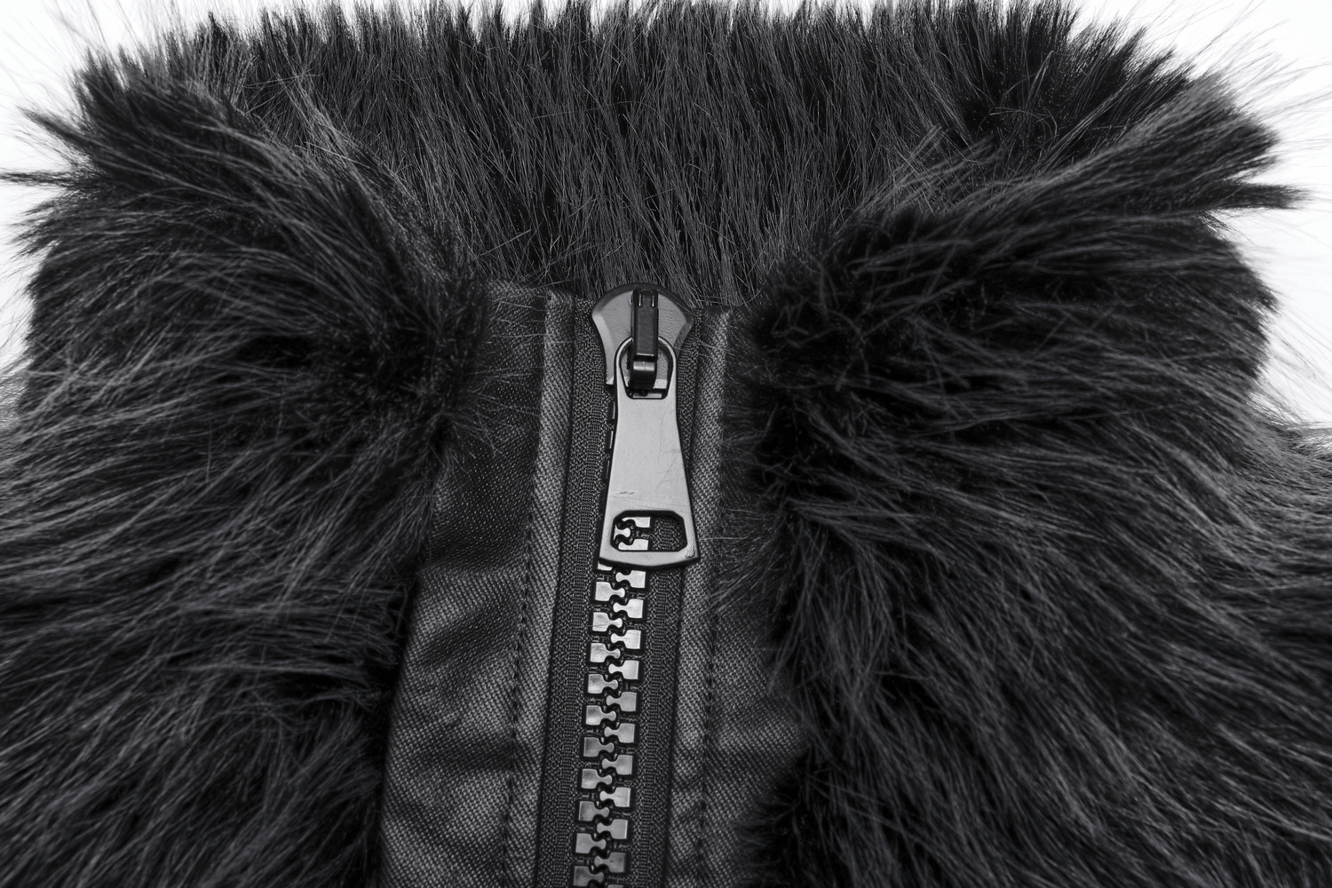 Close-up of the zipper detail on a gray faux fur jacket, highlighting its edgy design and luxurious texture.