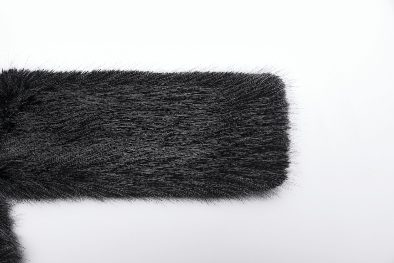 Close-up of soft gray faux fur fabric, highlighting its luxurious texture and warmth for stylish outerwear.