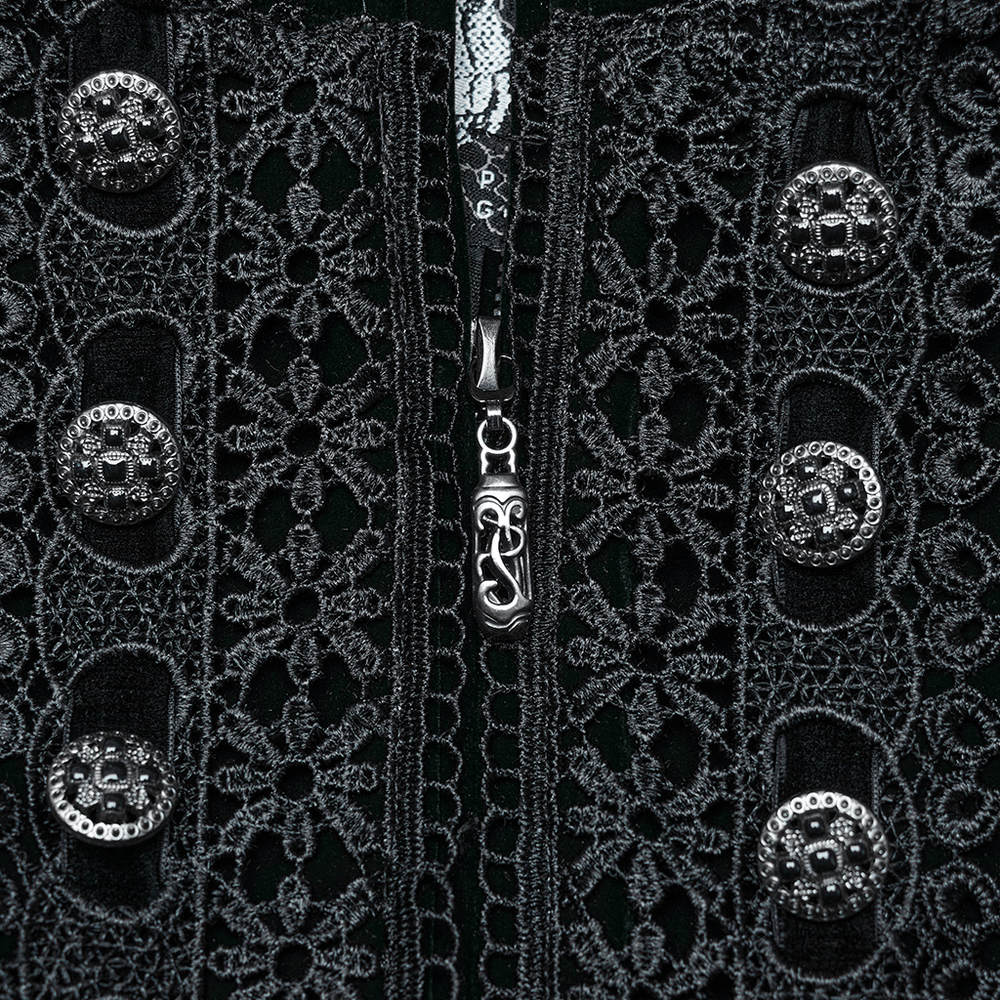 Close-up of green velvet Gothic coat with intricate lace and elegant button details, showcasing luxury and style.
