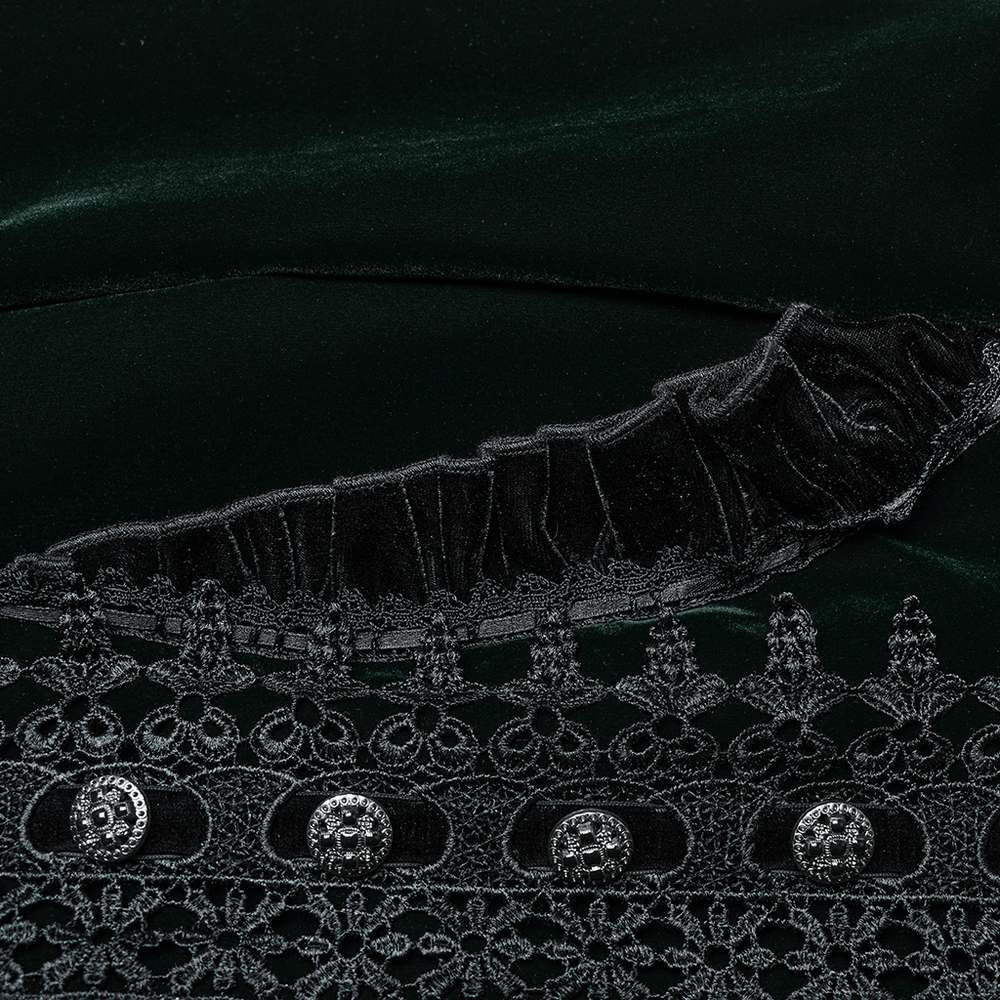 Close-up of luxurious green velvet with intricate lace and ruffle details, showcasing elegant Gothic design.