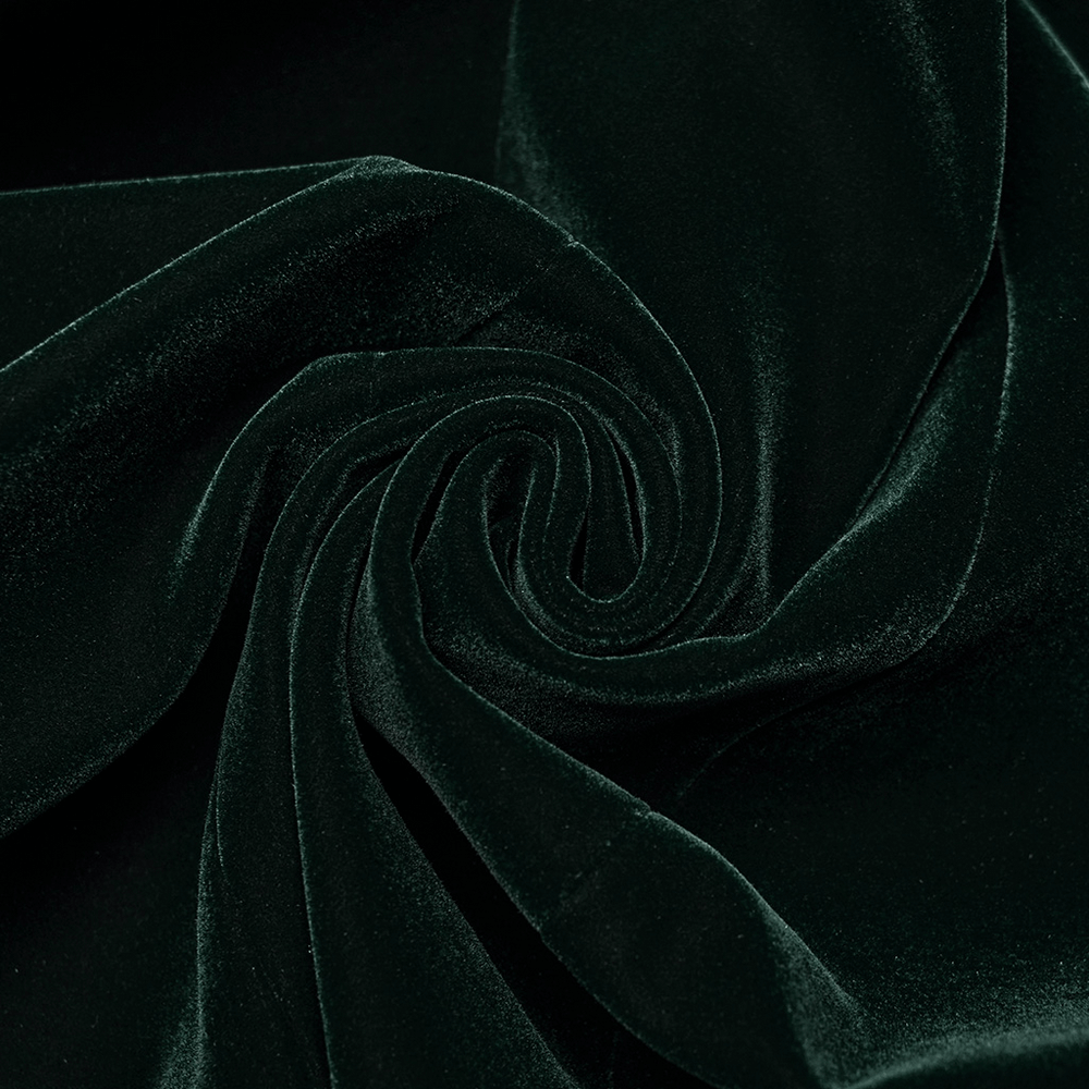 Luxurious green velvet fabric close-up, showcasing soft texture and rich color ideal for gothic fashion.