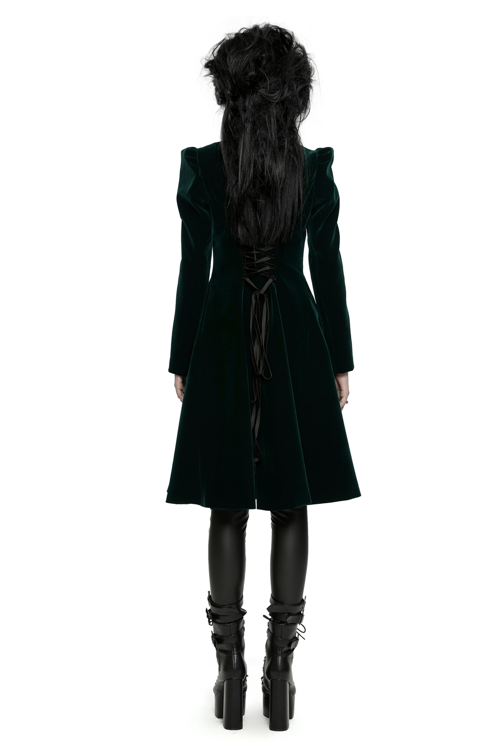 Back view of a green velvet Gothic coat with lace-up details and dramatic A-line silhouette, paired with black leather leggings.