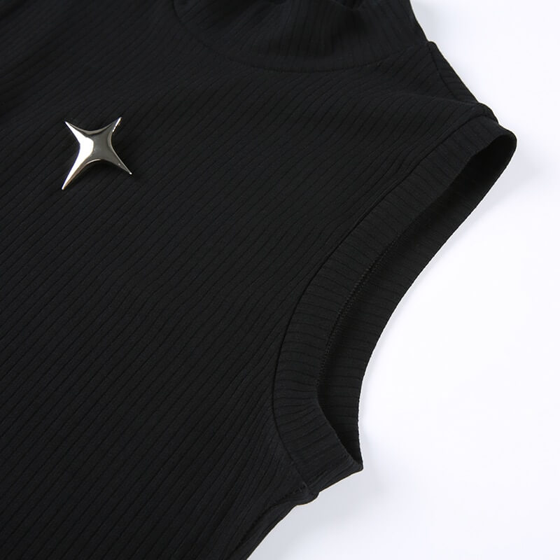 Close-up of a grunge black sleeveless tank top with an edgy silver star pin detail.