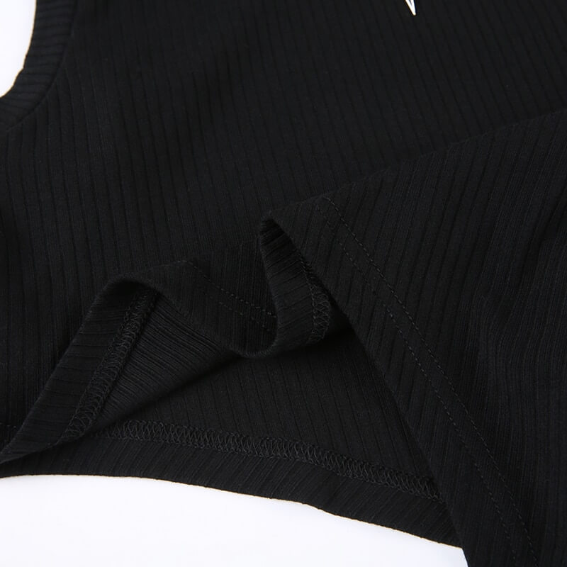 Close-up of the grunge black irregular tank top, showcasing its ribbed texture and unique hemline for punk style.