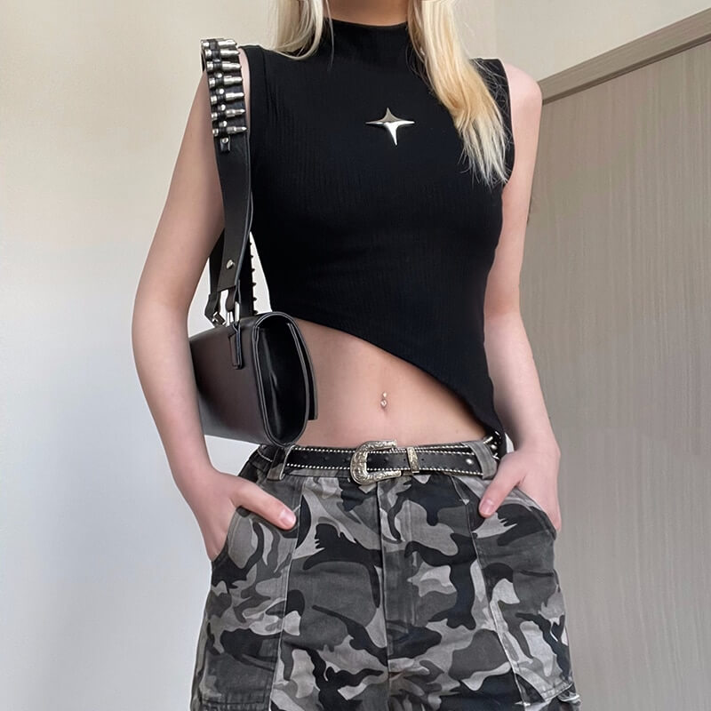 Stylish woman in a black irregular tank top paired with camo pants, showcasing punk aesthetic and edgy fashion.