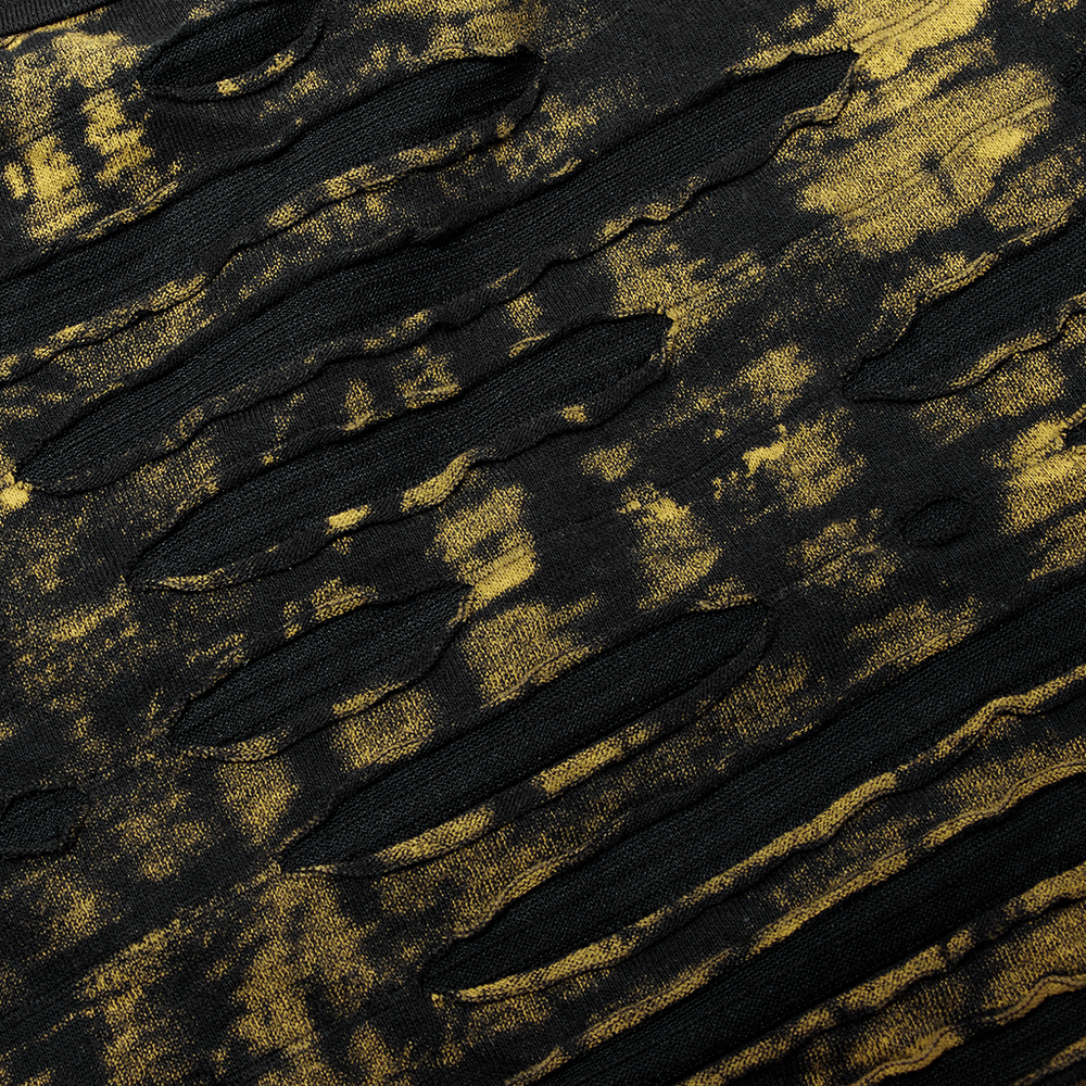 Close-up of ripped black and gold textured fabric, showcasing a grunge style for a Gothic t-shirt.