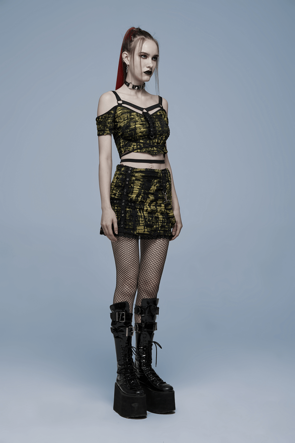 Gothic grunge crop t-shirt with strap detail, paired with a matching skirt and chunky platform boots.