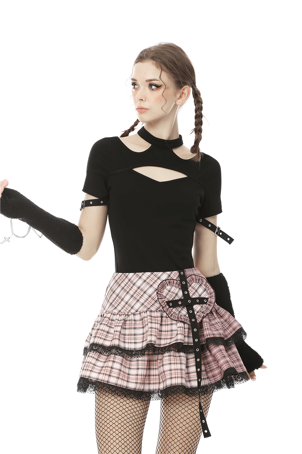 Edgy female model in black cutout top and pink plaid mini skirt with heart buckle, showcasing punk rock style.