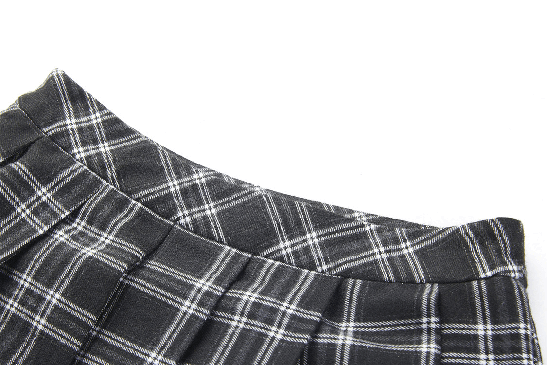 Close-up of a Grunge Gothic Asymmetrical Plaid Skirt with black and white plaid pattern and kilt-inspired design.