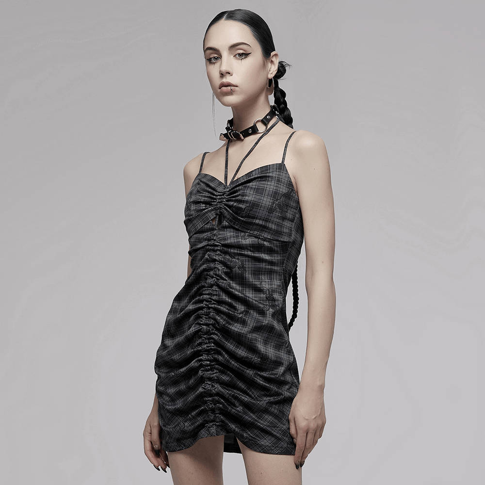 Grunge gothic lace-up mini bodycon dress with plaid pattern, adjustable drawcord, and trendy cut-out details.