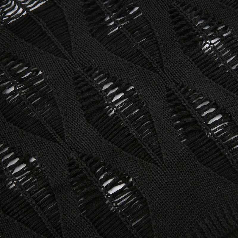 Close-up of stylish black fabric with hollow-out leaf patterns, showcasing grunge vintage texture for tops.