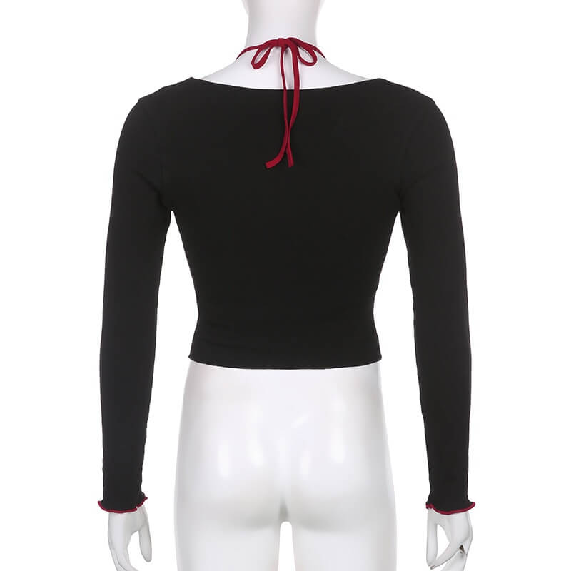 Back view of a grunge women's long-sleeve top with red tie detail, perfect for gothic aesthetic fashion.