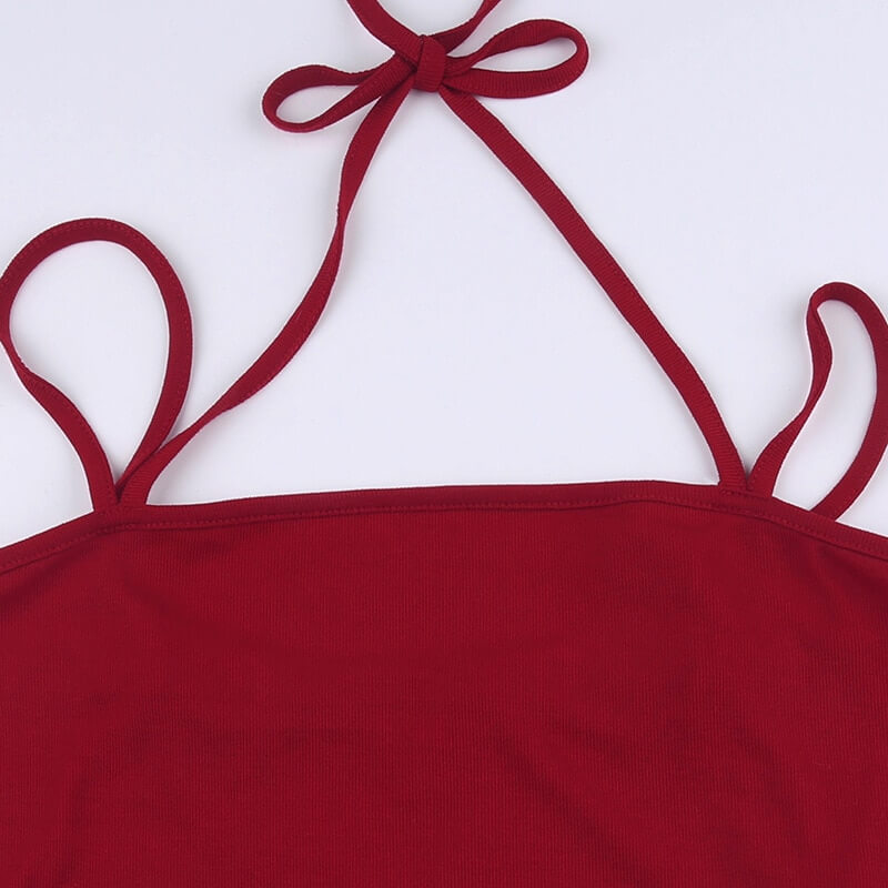 Close-up of a burgundy women's long-sleeve top with stylish ties and a sleek design, perfect for grunge fashion.