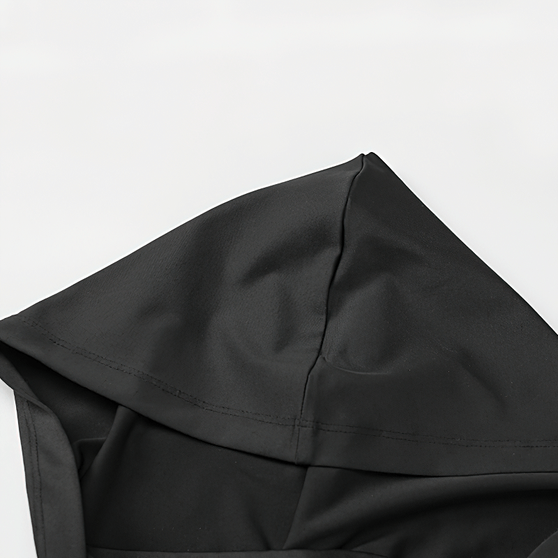 Close-up of the black hood of a grunge zip-up hoodie, showcasing its sleek design.