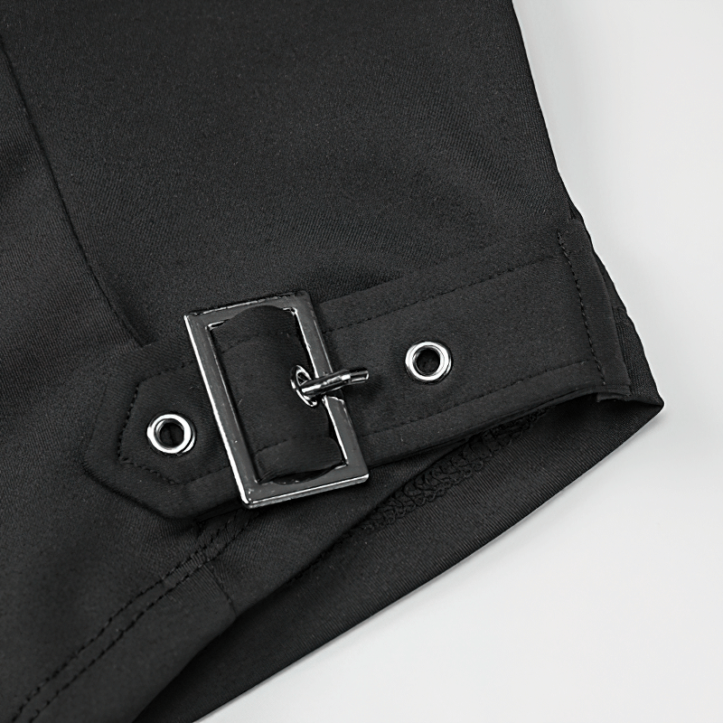 Close-up of black fabric with a stylish belt buckle detail, showcasing edgy design for grunge fashion.