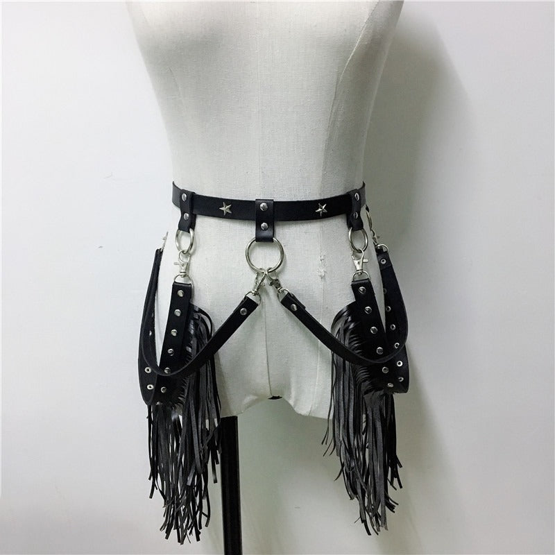 Trendy black leather harness belt with fringes and stainless steel accents for gothic and rave fashion.
