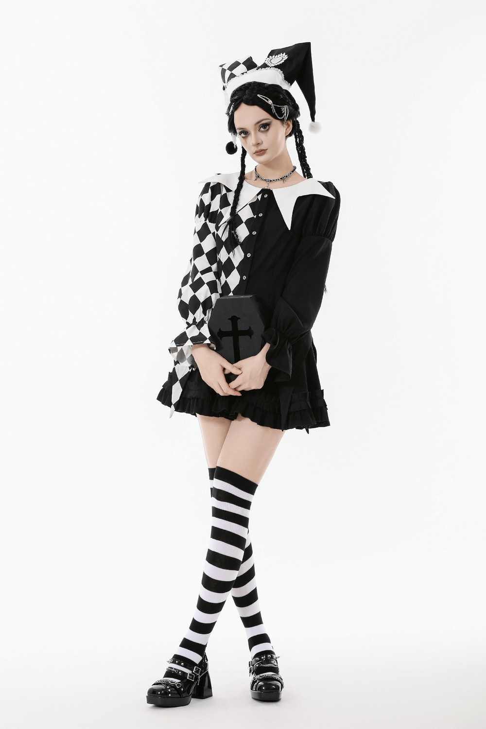 Harlequin Diamond Pattern Shirt with Front Button Detail, featuring playful puff sleeves and bold black and white patterns.