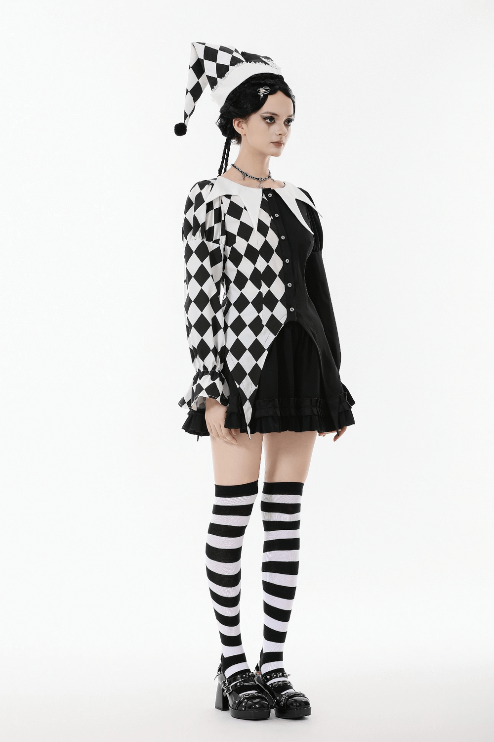 Harlequin Diamond Pattern Shirt with Front Button Detail in black and white diamond design, styled with puff sleeves.